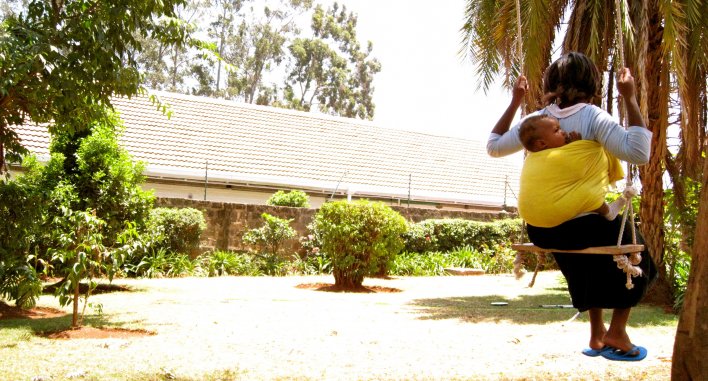 Mother and baby on swing